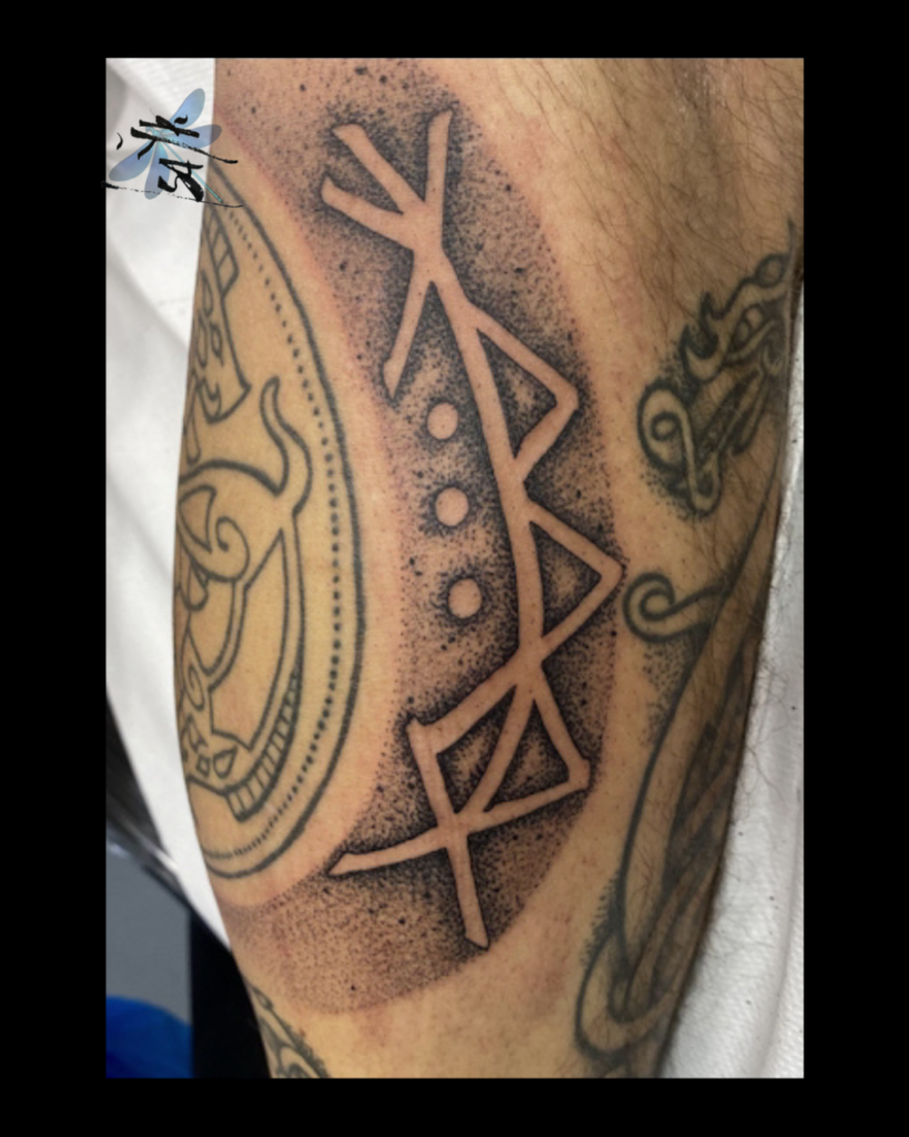 runic ornamental symbolic tattoo detail